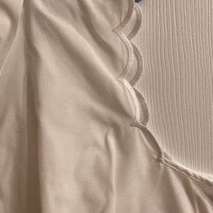 Plus size white scalloped sleeveless top